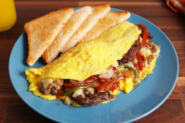 1494614947-delish-philly-cheesesteak-omelette-1