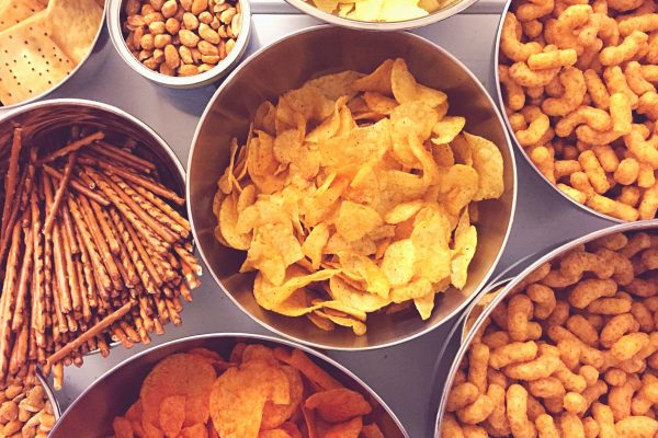 high-angle-view-of-various-snacks-in-bowls-royalty-free-image-1585063074