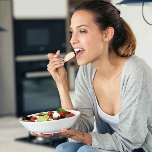 woman-eating-fruit-salad